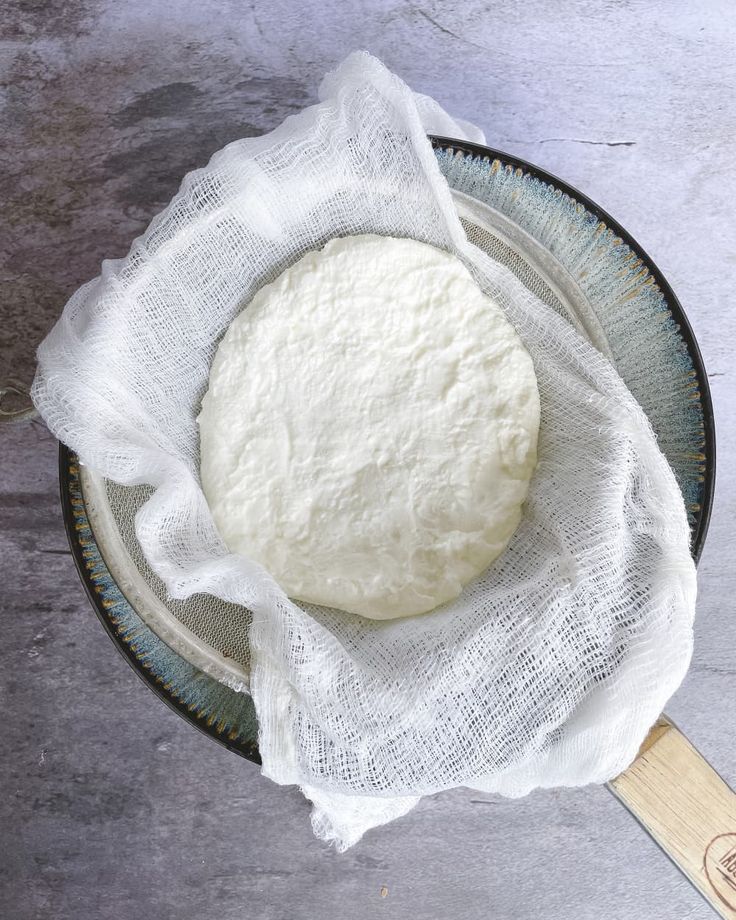 Fresh cheese in cheesecloth